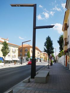 a city street lined with tall yellow buildings