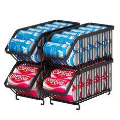 a stack of soda cans sitting on top of a metal rack next to each other