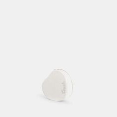 a small white object sitting on top of a table