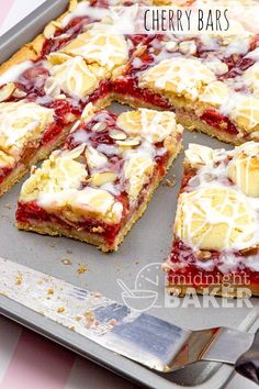 strawberry shortbread cherry bars on a baking sheet