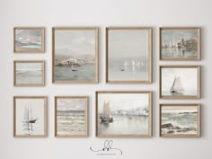 a bunch of pictures hanging on the wall with watercolors in them and sailboats out front