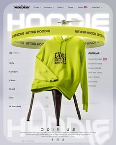 a neon green hoodie sitting on top of a wooden chair in front of a white background