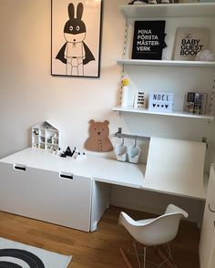 a child's room with a desk, chair and bookshelf in it