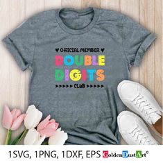 a t - shirt with the words double digits on it next to some tulips