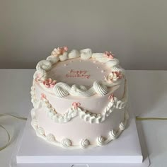 a white cake sitting on top of a table