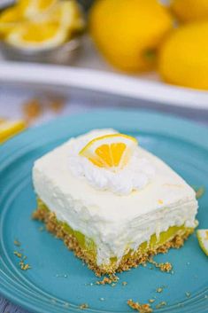 a slice of lemon cake on a blue plate