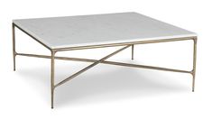 a white marble top coffee table with metal frame legs and gold trimming on the bottom