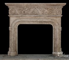 an old stone fireplace with carvings on it