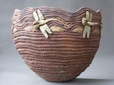 a brown basket with two dragonflies on it