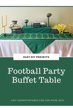 a football party buffet table with green cloth and yellow flowers on the table, in front of a white wall