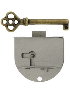 an old style door handle with a key on it and a hole in the middle