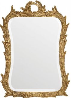 an ornate gold framed mirror on a white background