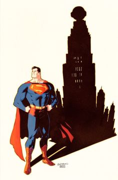 superman standing in front of the shadow of a tall building with his cape up and hands on his hips