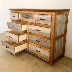 an old dresser with drawers is made out of wood