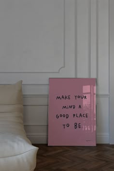 a pink sign that says make your mind a good place to be on the floor