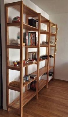 a wooden shelf with many books on it