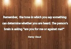 a wooden wall with three lights on it and a quote from henry cloud that says, remember, the tone in which you say something can determine when you are heard