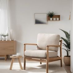 a living room with white walls and wooden furniture, including a chair in front of a window