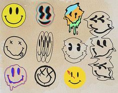 an assortment of smiley face stickers on a piece of white paper with black ink