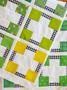 two quilts that are laying on top of each other, one is green and the other is yellow