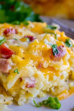 cheesy overnight hashbrown breakfast casserole on a white plate with text overlay