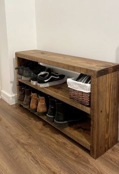 a wooden bench with shoes on it next to a radiator