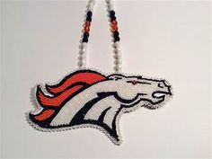 a beaded necklace with an orange and white denver football logo hanging from it's side