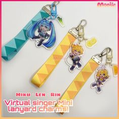 three keychains with anime characters on them, one is yellow and the other is blue