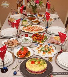 the table is set with many different types of food