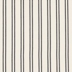 a black and white striped wallpaper with small dots on the bottom half of it