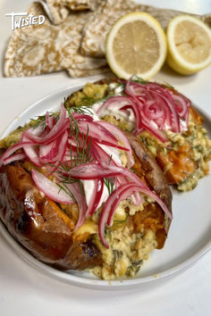 the meal is prepared and ready to be eaten on the table with lemons in the background