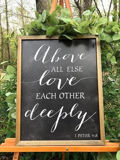 a chalkboard sign that says, we are all else love each other deeply