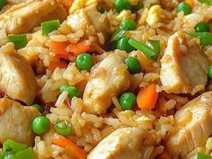 chicken and rice with peas on a plate