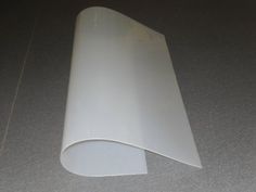 a roll of white plastic sitting on top of a floor