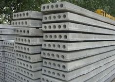 large stack of concrete blocks sitting next to each other