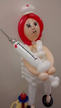 an inflatable balloon with a nurse holding a baby