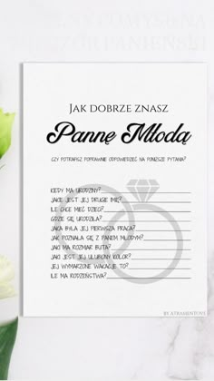 a card with the names of two people on it and flowers in front of it