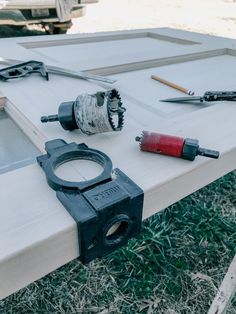 tools are sitting on top of a white table