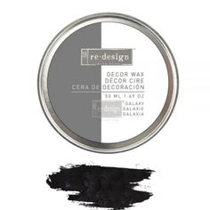 a tin of black and white paint with the words decor wax on it's side