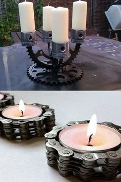 four candles sitting on top of a table next to an old bicycle chain candle holder