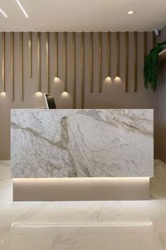 a white marble reception counter in a lobby