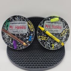 two black and white coasters with different colored items on them next to each other