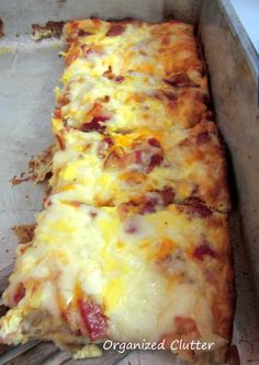 a long rectangular pizza sitting on top of a pan