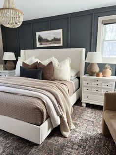 a large bed sitting in a bedroom on top of a rug