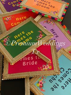 there are many different wedding signs on the table