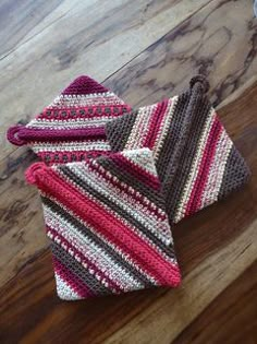 three crocheted ties sitting on top of a wooden floor