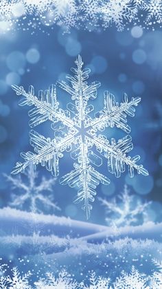 a snowflake is shown in the middle of a blurry background with blue boke