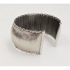 This is part of Chairish’s Costume Jewelry assortment.  1960s rhodium plated fleur de lis cuff bracelet. Marked "Jewels by Julio." Measures:  2 1/4 inches wide by 1 3/16 inches tall by 2 inches deep. Condition: Very good; some minor surface wear towards the back and to the signature. Harder to see in person than in the photos. Elegant Wide Band Metal Cuff Bracelet, Silver Vintage Cuff Bracelet For Formal Occasions, Silver Wide Band Metal Bracelet, Silver Wide Band Metal Bangle, Silver Metal Cuff Bangle, Silver Metal Cuff Bracelet With Intricate Design, Elegant Antique Silver Metal Bangle, Wide Band Metal Bracelets For Formal Occasions, Formal Wide Band Metal Bracelets