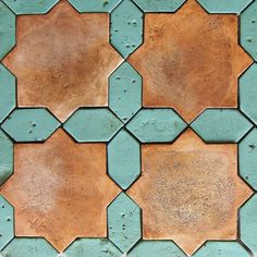 a close up view of an old tile pattern