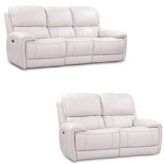 two white leather reclining sofas sitting next to each other on a white background